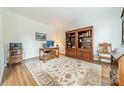 Home office with built-in shelving and hardwood floors at 15604 Wynford Hall St, Huntersville, NC 28078