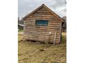 Wooden cabin exterior showcasing rustic charm and natural wood tones at 166 Cheryls Pass None, Love Valley, NC 28625