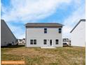 Rear view of two-story house showcasing backyard and patio at 2246 Catawba Trace Dr, Catawba, NC 28609