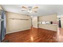 Living room with hardwood floors, fireplace and ceiling fan at 232 14Th Se Ave # E, Hickory, NC 28502