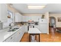 Modern kitchen with white cabinets and spacious island at 2590 Pierson St, Newton, NC 28658