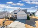 House in a neighborhood with manicured lawns and other homes visible at 2706 White Pines Ct, Monroe, NC 28112