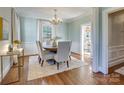 Elegant dining room with a round table and hardwood floors at 2912 Park Rd, Charlotte, NC 28209