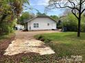 House exterior showcasing a large backyard and driveway at 306 Union St, Maiden, NC 28650