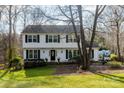 Two-story house with white siding, black shutters, and a manicured lawn at 3165 Wimbledon Ln, Rock Hill, SC 29732