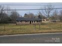 Ranch home with a fenced yard and mature trees at 4804 Chapel Grove Rd, Gastonia, NC 28052