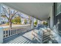 Spacious front porch offering views of a tree-lined street at 506 S Chester St, Gastonia, NC 28052