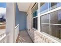 Small front porch with white railing and brick exterior at 5107 Lakeview Rd, Charlotte, NC 28216