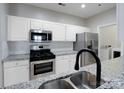 Modern kitchen with stainless steel appliances and granite countertops at 5617 Fairview Rd # 9, Charlotte, NC 28209