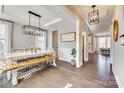 Bright dining room with a farmhouse table and chandelier at 6265 Six String Ct, Fort Mill, SC 29708