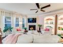 Bright living room with a fireplace, built-in shelving, and comfortable seating at 6417 Union Station Ct, Charlotte, NC 28210