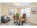 Spacious bedroom with a large window and stylish workspace setup at 6808 Cascade Dream Ct # 118, Huntersville, NC 28078