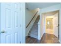 Bright entryway with staircase leading upstairs and view of a bathroom at 6808 Cascade Dream Ct # 118, Huntersville, NC 28078