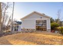 Detached garage with large glass door and stone accents at 7476 Point St, Denver, NC 28037