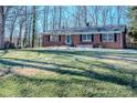 Brick ranch house with a spacious lawn and mature trees at 940 Valley Dr, Newton, NC 28658