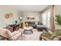 Living room features hardwood floors, a neutral color palette, and ample natural light at 941 Squirrel Hill Rd, Charlotte, NC 28213