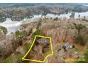 Lakefront property with a large lot and wooded area at 102 Serene St, Mount Gilead, NC 27306