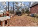 Large backyard with playset, trampoline, and shed at 102 Serene St, Mount Gilead, NC 27306