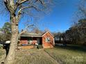 Brick ranch house with front porch and yard at 114 Barker Rd, Dallas, NC 28034