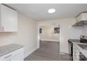 Updated kitchen with white cabinets and granite countertops at 1464 Bradford Heights Rd, Gastonia, NC 28054