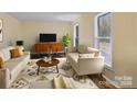 Bright living room featuring stylish furniture, area rug, and a modern entertainment center at 3 Old Farm Rd, Salisbury, NC 28147