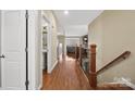 Bright hallway with hardwood floors, leading to a bathroom and living area at 3976 Stadler Ne Dr, Conover, NC 28613