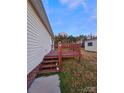 Outdoor wooden deck with steps, perfect for entertaining and relaxation at 402 Self St, Cherryville, NC 28021