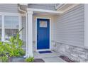 Blue front door with a glass panel and stone accents at 525 Grandiflora Ave # 101, Lancaster, SC 29720