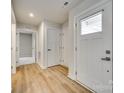 Light and bright hallway with light wood flooring at 525 Grandiflora Ave # 101, Lancaster, SC 29720