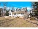 Charming two-story home with a wrap around porch and stone accents at 7918 Ridgeview Dr, Sherrills Ford, NC 28673