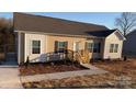 Charming single-story home boasts newly installed siding and a welcoming front porch entrance at 819 Wellwood Ave, Statesville, NC 28677