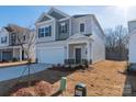 Charming two-story home with a two-car garage and well-maintained lawn at 1169 Red River Dr, Salisbury, NC 28144