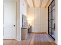 Light and airy entryway with wood floors and built-in bench at 1214 S Kings Dr # A, Charlotte, NC 28207