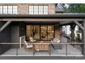 Spacious covered patio with fireplace and comfortable seating, perfect for outdoor entertaining at 1214 S Kings Dr # A, Charlotte, NC 28207