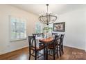 Elegant dining room featuring hardwood floors and a modern chandelier at 14450 Maritime Dr, Lancaster, SC 29720