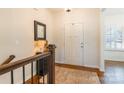 Bright foyer with hardwood floors, a white front door, and a decorative mirror at 14450 Maritime Dr, Lancaster, SC 29720