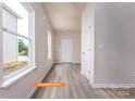 Bright entryway boasting natural light through a large window and durable wood-look floors at 1630 Troon Dr, Salisbury, NC 28144