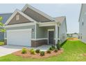 Inviting single-story home featuring a covered entryway and well-maintained lawn at 1630 Troon Dr, Salisbury, NC 28144