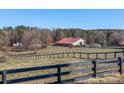 Large red barn with horse pasture at 172 Tuckertown Rd, New London, NC 28127