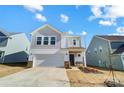 Two-story house with gray siding, white trim, and a two-car garage at 202 Brentwood Dr, Statesville, NC 28625