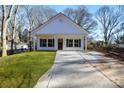 Newly built home with a concrete driveway and grassy lawn at 408 N Boyd St, Gastonia, NC 28052