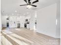 Open concept living space with kitchen and hardwood floors at 408 N Boyd St, Gastonia, NC 28052