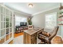 Spacious home office with built-in shelving and hardwood floors at 4469 Morning Dove Ct, Denver, NC 28037