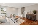 Spacious living room with hardwood floors and stairs at 512 Wakefield Dr, Charlotte, NC 28209