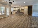 Open-concept living area with white cabinetry and gray countertops, seamlessly connecting to a spacious kitchen at 609 Shiloh Unity Rd, Lancaster, SC 29720