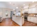 Bright kitchen featuring stainless steel appliances and a granite countertop island at 6411 Aldworth Ln, Charlotte, NC 28226