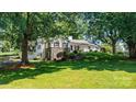 Beautiful white brick home with stone accents, situated on a lush green lawn at 842 North Center St, Hickory, NC 28601