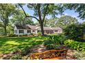 House exterior showcasing a spacious backyard with mature landscaping at 842 North Center St, Hickory, NC 28601