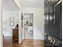 Bright entryway with hardwood floors and view of kitchen at 857 Fairbanks Rd, Charlotte, NC 28210