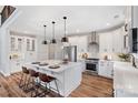 Spacious kitchen with white cabinets, island, and stainless steel appliances at Lot 2 Glenview Meadow Dr # Savanh, Waxhaw, NC 28173